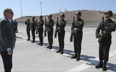 Turkey's President Recep Tayyip Erdogan inspects a military honor guard before addressing his supporters in Bursa, Turkey, August 4, 2019 (Presidential Press Service via AP, Pool)