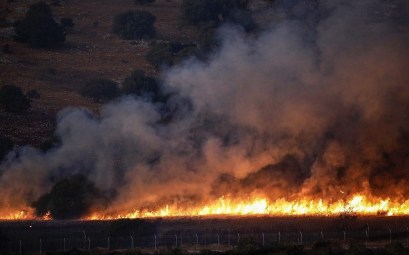 This picture taken on September 1, 2019, from a location near the northern Israeli town of Avivim, shows a fire blazing in a field along the border with Israel on the Lebanese side following an exchange of fire. (ALAA MAREY / AFP)