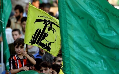 Hamas supporters in Gaza hold Hezbollah and Islamic flags as they demonstrate against Israel  during the Second Lebanon War on July 30, 2006. (AP/Khalil Hamra)