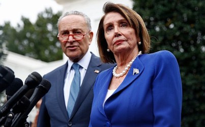 House Speaker Nancy Pelosi of California, right, speaks with members of the media alongside Senate Minority Leader Senator Chuck Schumer of New York after a meeting with US President Donald Trump, October 16, 2019, in Washington. (AP Photo/Patrick Semansky)