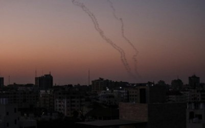 Palestinians fire rockets from Gaza City toward Israel on November 12, 2019. (Photo by MAHMUD HAMS / AFP)