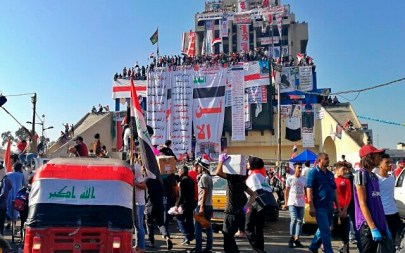 Anti-government protesters gather in Tahrir Square during ongoing protests in Baghdad, Iraq, Friday, Nov. 1, 2019. (AP Photo/Khalid Mohammed)