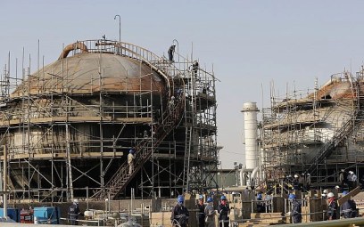 During a trip organized by the Saudi information ministry, workers fix the damage in Aramco's oil separator at processing facility after the September 14 attack in Abqaiq, near Dammam in the Kingdom's Eastern Province, September 20, 2019. (AP Photo/Amr Nabil)