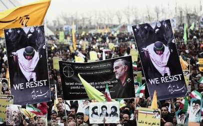 Iranian demonstrators hold a portrait of Maj. Gen. Qassem Soleimani, commander of the Quds Force in the Iranian Revolutionary Guards and a central figure in the violent spread of Iran's revolution. Photo taken in Tehran's Azadi Square, February 11, 2015. (Behrouz Mehri/AFP)