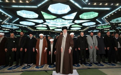 In this photo released by the official website of the office of the Iranian supreme leader, Supreme Leader Ayatollah Ali Khamenei, center, leads the Friday prayers at Imam Khomeini Grand Mosque in Tehran, Iran, Friday, Jan. 17, 2020.  (Office of the Iranian Supreme Leader via AP)