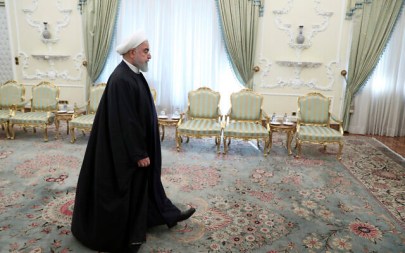 Iranian President Hassan Rouhani arrives for a meeting at the presidency office in Tehran, Iran, December 23, 2019. (Ebrahim Noroozi/AP)