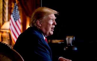 In this Dec. 24, 2019 photo, President Donald Trump speaks to members of the media following a Christmas Eve video teleconference with members of the military at his Mar-a-Lago estate in Palm Beach, Fla.  (AP Photo/Andrew Harnik)