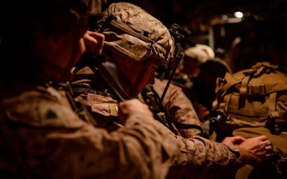 In this photo provided by US Department of Defense, US Marines assigned to Special Purpose Marine Air-Ground Task Force-Crisis Response-Central Command (SPMAGTF-CR-CC) 19.2, prepare to deploy from Kuwait in support of a crisis response mission, Tuesday, Dec. 31, 2019. (US Marine Corps photos by Sgt. Robert G. Gavaldon via AP)