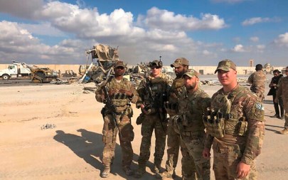 US Soldiers stand at a site of Iranian bombing at Ain al-Asad air base in Anbar, Iraq, Monday, Jan. 13, 2020. (AP/Qassim Abdul-Zahra)