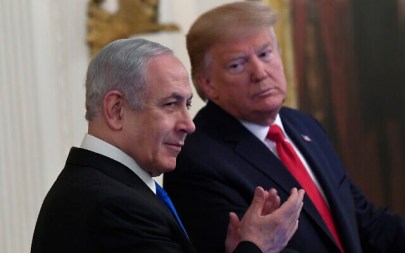 President Donald Trump, right, looks over to Israeli Prime Minister Benjamin Netanyahu, left, during an event in the East Room of the White House in Washington, Tuesday, Jan. 28, 2020 (AP/Susan Walsh)
