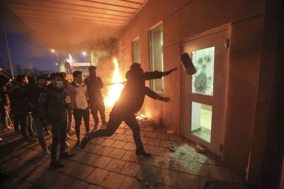 BAGHDAD, IRAQ - DECEMBER 31: Outraged Iraqi protesters storm the U.S. Embassy in Baghdad, protesting Washington's attacks on armed battalions belong to Iranian-backed Hashd al-Shaabi forces on December 31, 2019. At least 25 people were killed in weekend U.S. airstrikes on positions of Kataib Hezbollah, an Iranian-backed militia group, in Iraq and Syria. Hundreds of Iraqi protesters gathered early Tuesday near the embassy to show their anger at the U.S. move.