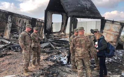 US soldiers stand amid damage at a site of Iranian bombing at Ain al-Asad air base, in Anbar, Iraq, January 13, 2020. (AP/Qassim Abdul-Zahra)