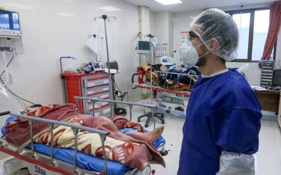 A nurse cares for patients in a ward dedicated for people infected with the coronavirus, at Forqani Hospital in Qom, Iran, Feb. 26, 2020 (Mohammad Mohsenzadeh/Mizan News Agency via AP )