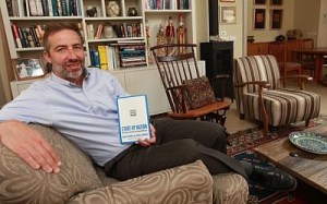 Saul Singer with a copy of "Start-Up Nation" (Photo credit: Nati Shohat/Flash90)