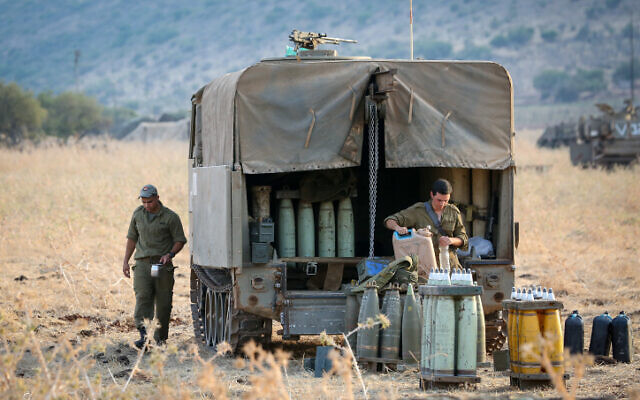 Israeli army forces seen stationed near the border between Israel and Lebanon in the Golan Heights on July 27, 2020. (David Cohen/Flash90) Israeli army forces seen stationed near the border between Israel and Lebanon in the Golan Heights on July 27, 2020. (David Cohen/Flash90)