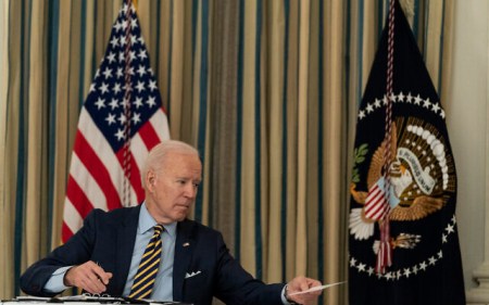 US President Joe Biden passes a note to Secretary of State Antony Blinken, during a virtual meeting with Indian Prime Minister Narendra Modi, Australian Prime Minister Scott Morrison and Japanese Prime Minister Yoshihide Suga, from the State Dining Room of the White House, March 12, 2021, in Washington. (AP Photo/Alex Brandon)