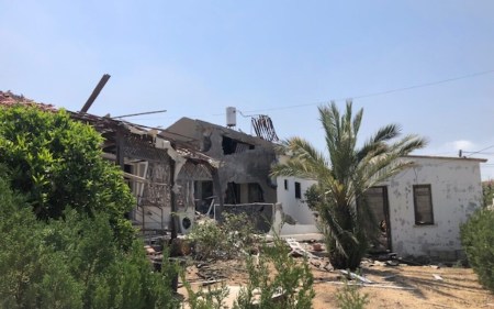 A home in Ashkelon damaged by rocket fire, which left a caregiver dead and an elderly woman badly injured, Tuesday May 12, 2021 (Lazar Berman. Times of Israel)
