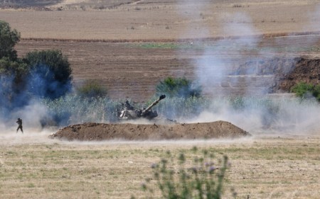 An Israel Defense Forces artillerypiece fires toward the Gaza Strip on May 18, 2021, amid fighting between the Israel Defense Forces and the coastal enclave's Hamas rulers. (Gili Yaari/Flash90)