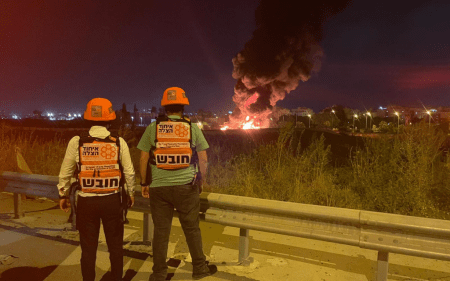 Paramedics observe a fire in Ramle, May 13, 2021. (United Hatzalah)