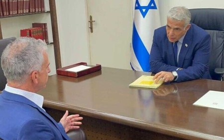 Prime Minsiter Yair Lapid meets with the head of the Mossad David Barnea at the Defense Ministry, Tel Aviv, August 25, 2022. (Prime Minister's Office)