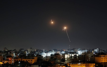 Streaks of light are seen as Israel's Iron Dome air defense system intercepts rockets fired by Palestinian terror groups from the Gaza Strip into Israeli territory on April 7, 2023. (Photo by MOHAMMED ABED / AFP)