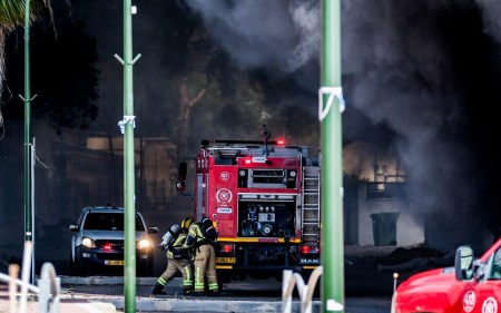 Firefighters work to extinguish a fire after a rocket fired from Lebanon hit the Israeli town of Shlomi, April 6, 2023.(Fadi Amun/Flash90) Firefighters work to extinguish a fire after a rocket fired from Lebanon hit the Israeli town of Shlomi, April 6, 2023.(Fadi Amun/Flash90)