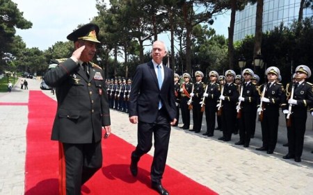 Defense Minister Yoav Gallant (right) walks with his Azerbaijani counterpart, Minister of Defense Col. Gen. Zakir Hasanov in Baku, Azerbaijan, July 13, 2023. (Ariel Hermoni/Defense Ministry)