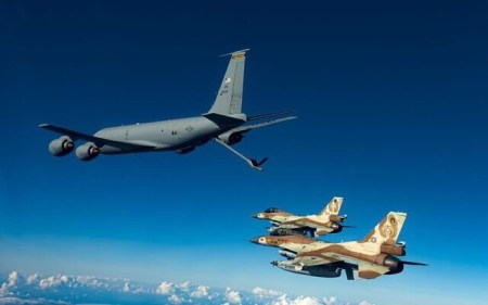 An American KC-135 aerial refueling aircraft refuels IAF F-16i fighter jets during an exercise over Israel, November 30, 2022. (Israel Defense Forces)